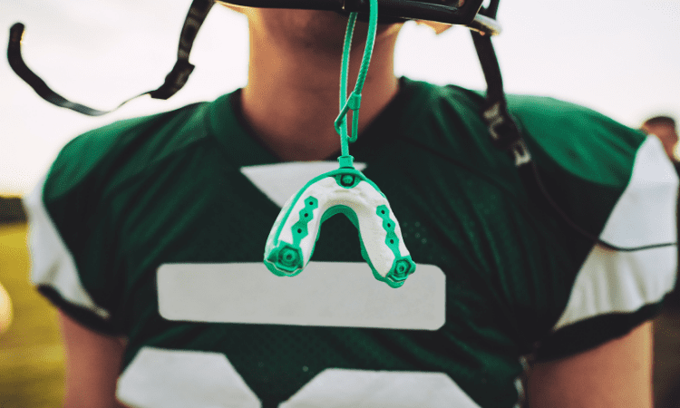 A custom mouthguard provides an effective solution, offering better protection than over-the-counter options.